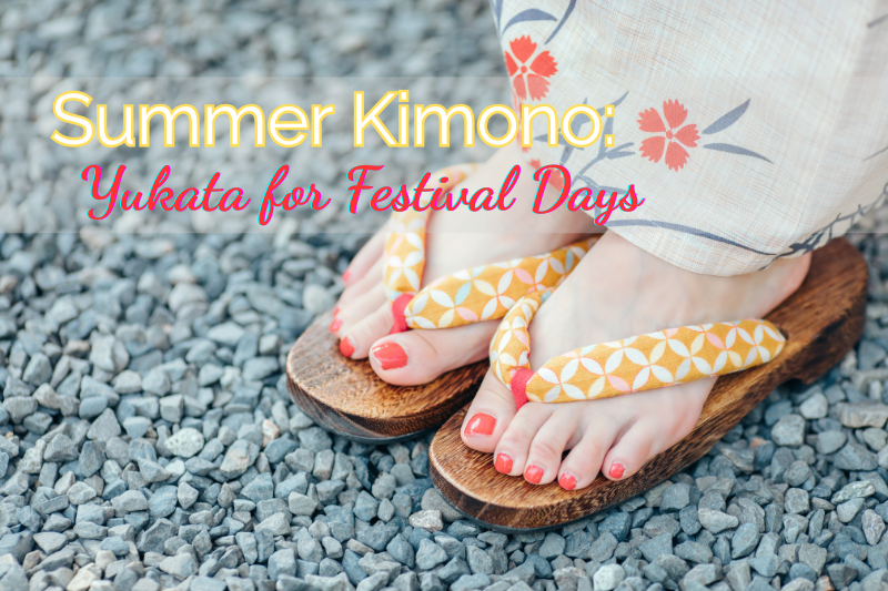 A close-up of a woman’s feet wearing a floral summer yukata and traditional wooden geta sandals, standing on gravel. A casual yet elegant look often seen at Japanese festivals.