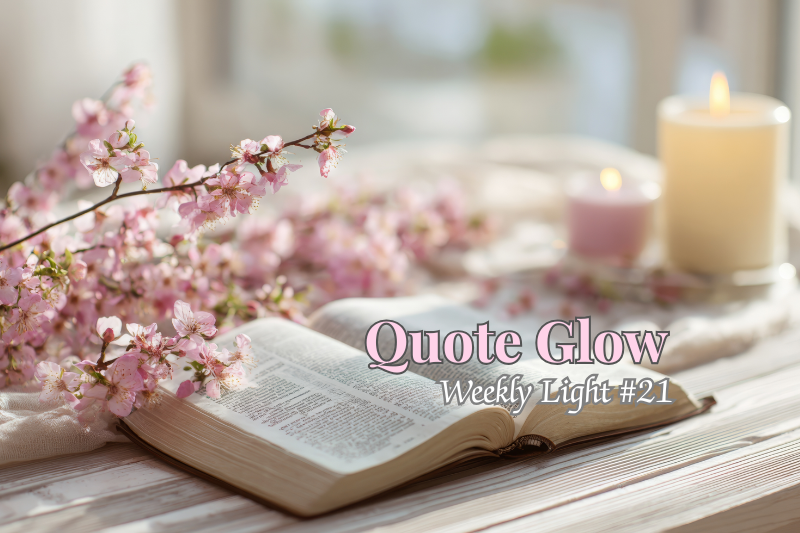 A softly lit scene with an open book, delicate pink blossoms, and candles, creating a calm and reflective atmosphere.