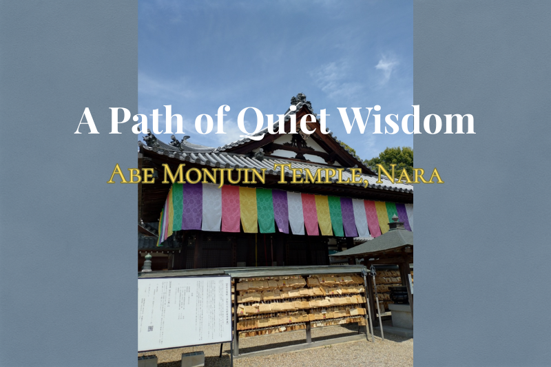 Abe Monjuin Temple main hall in Nara, Japan, with colorful Buddhist banners and a traditional wooden structure under a blue sky