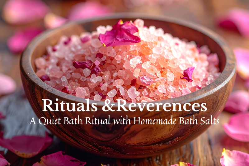 Wooden bowl filled with pink bath salts and rose petals, surrounded by scattered rose petals, representing a quiet self-care ritual and relaxation.
